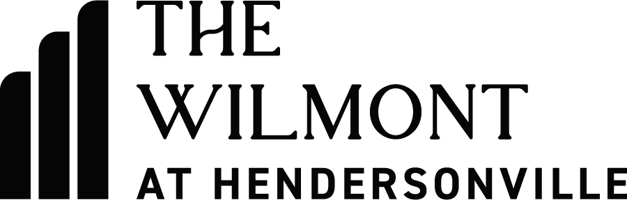 A sign that says "The Wilmont at Hendersonville" in white text on a green background.